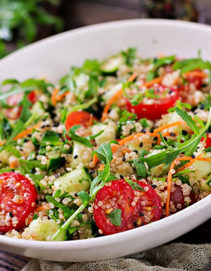 cucumber in bowl on  wooden background.  Healthy food, diet, detox and vegetarian concept.