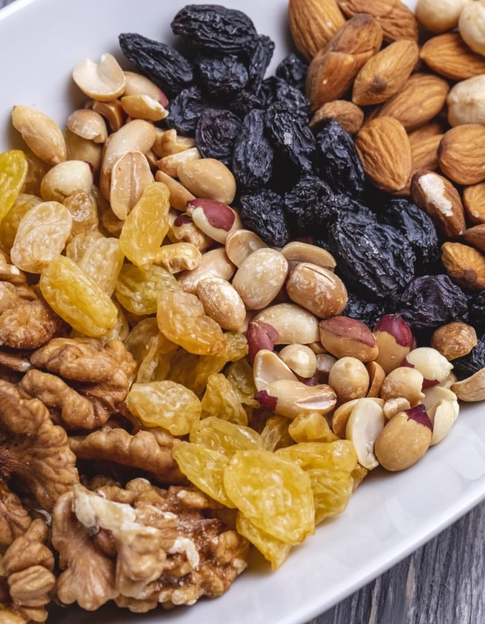 top view mix nuts walnuts raisins peanuts and almonds